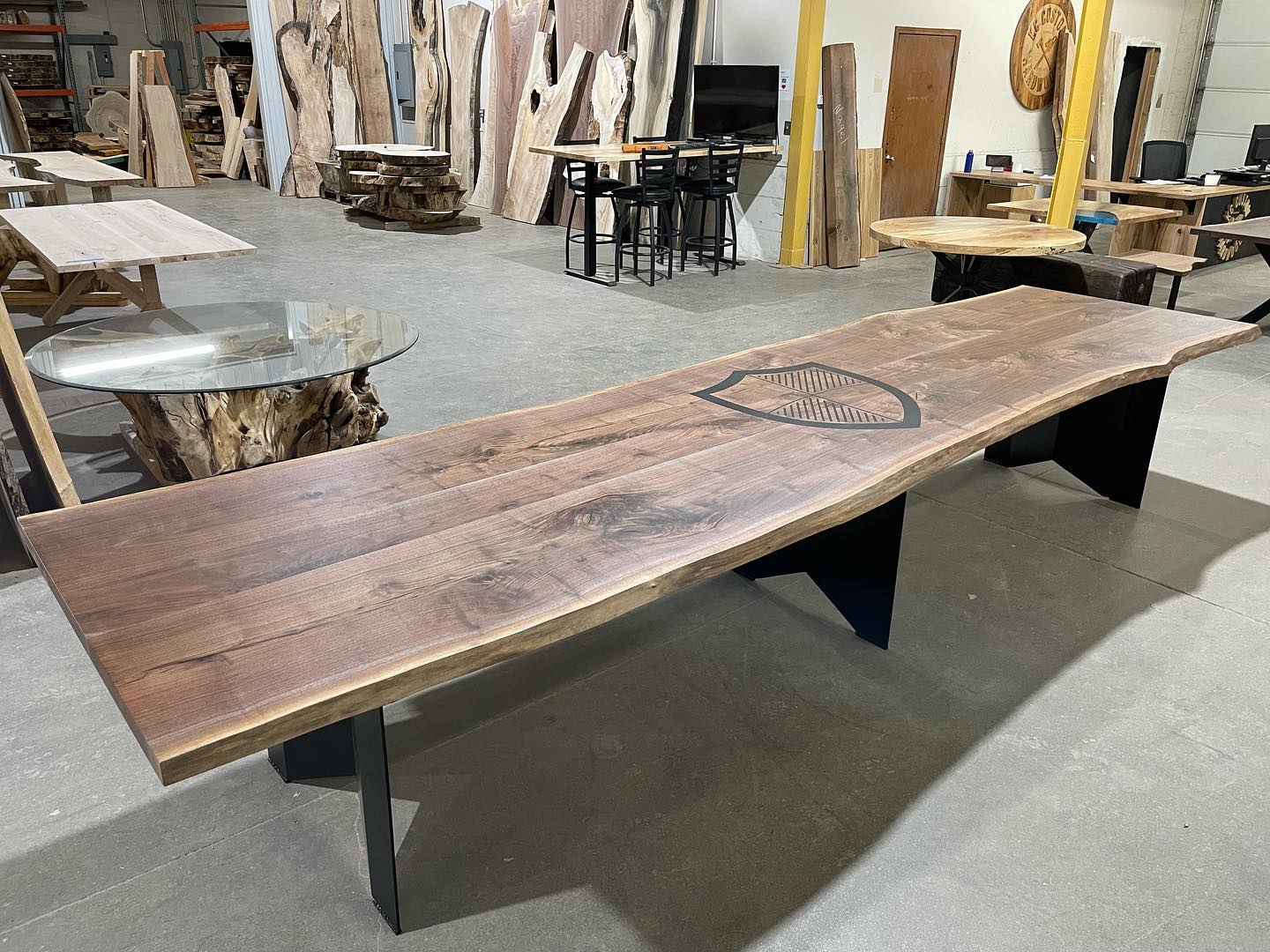 Live edge black walnut conference table with custom logo