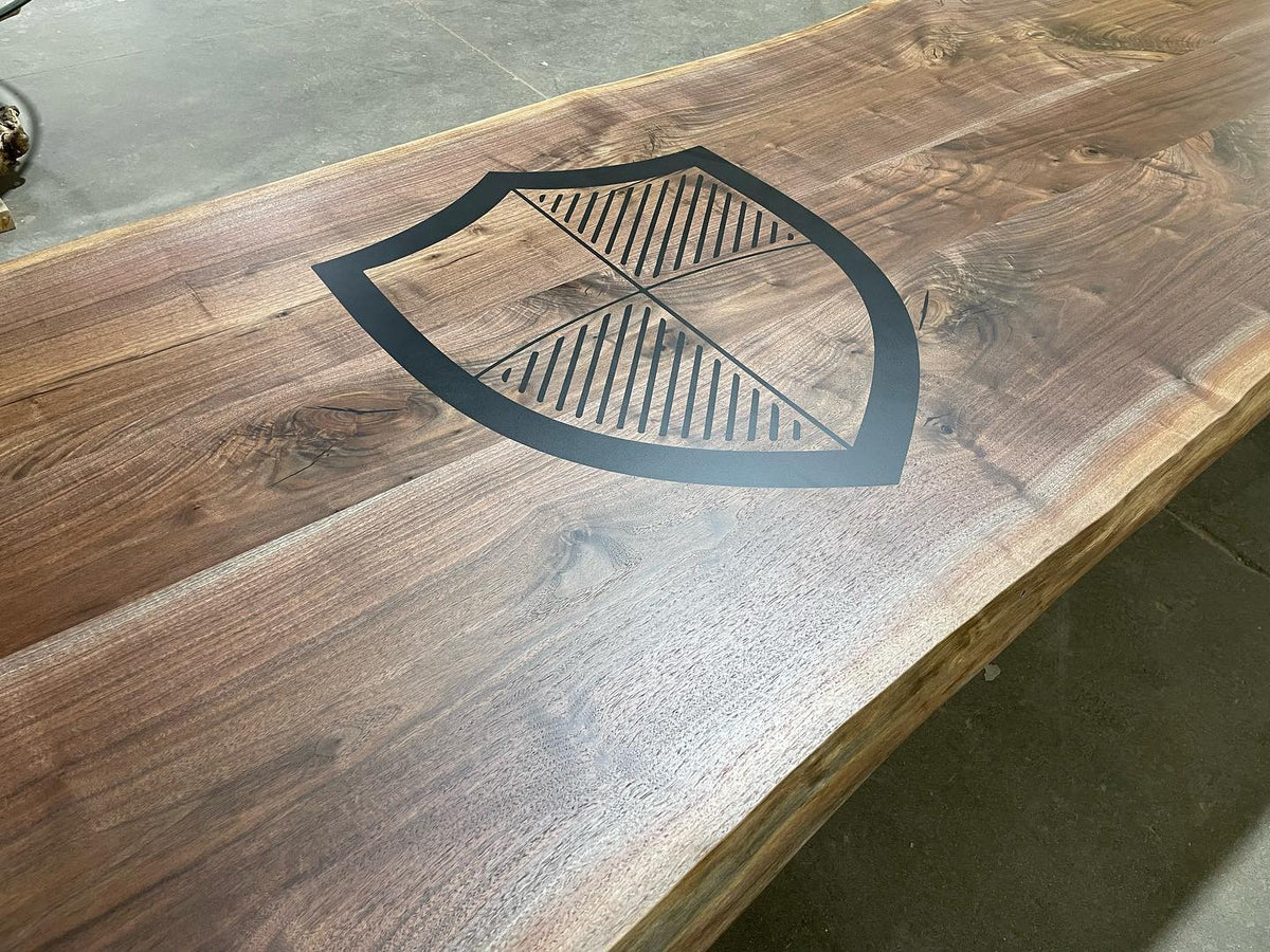 Live edge black walnut conference table with custom logo