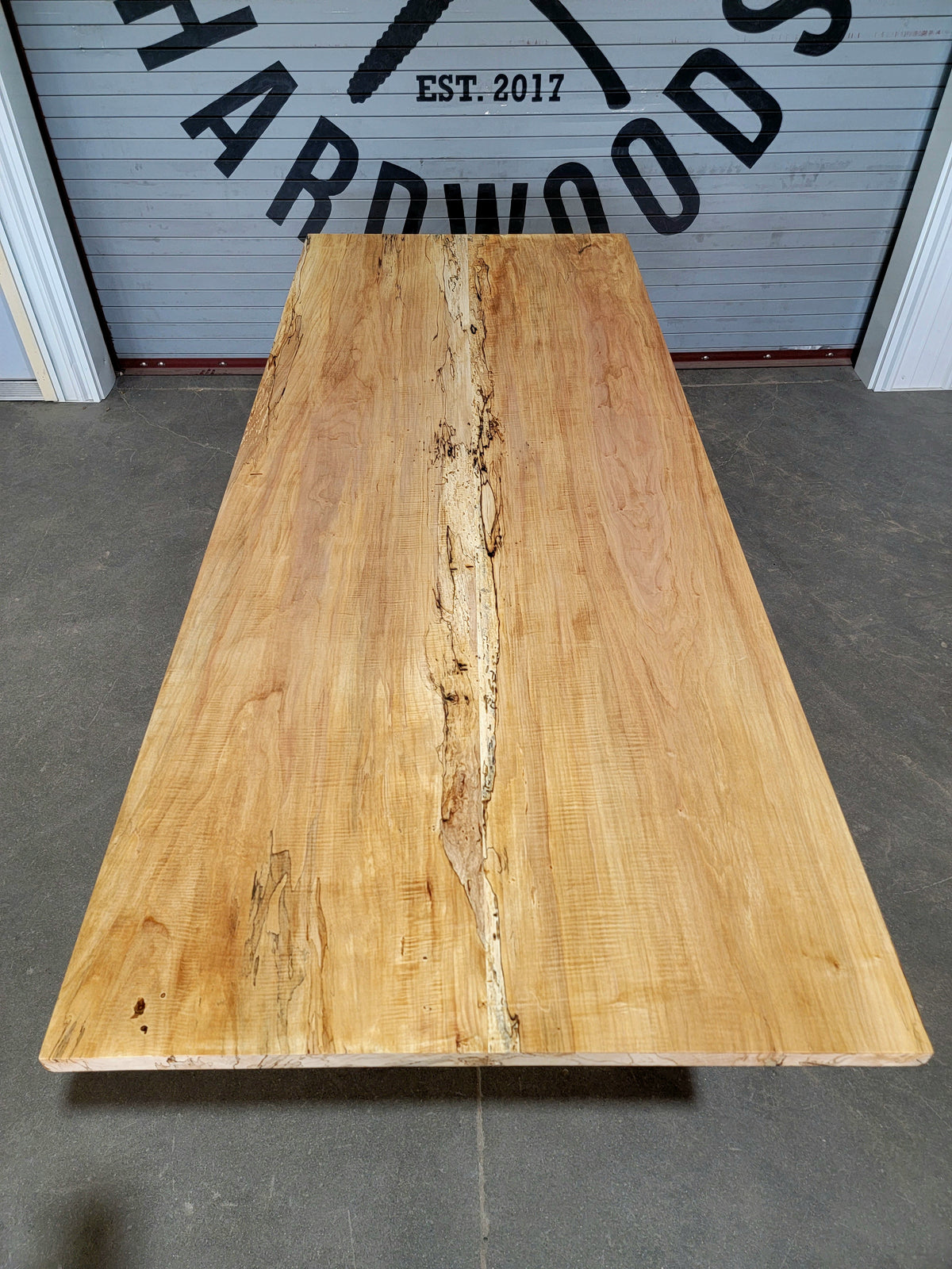 maple dining table on steel base