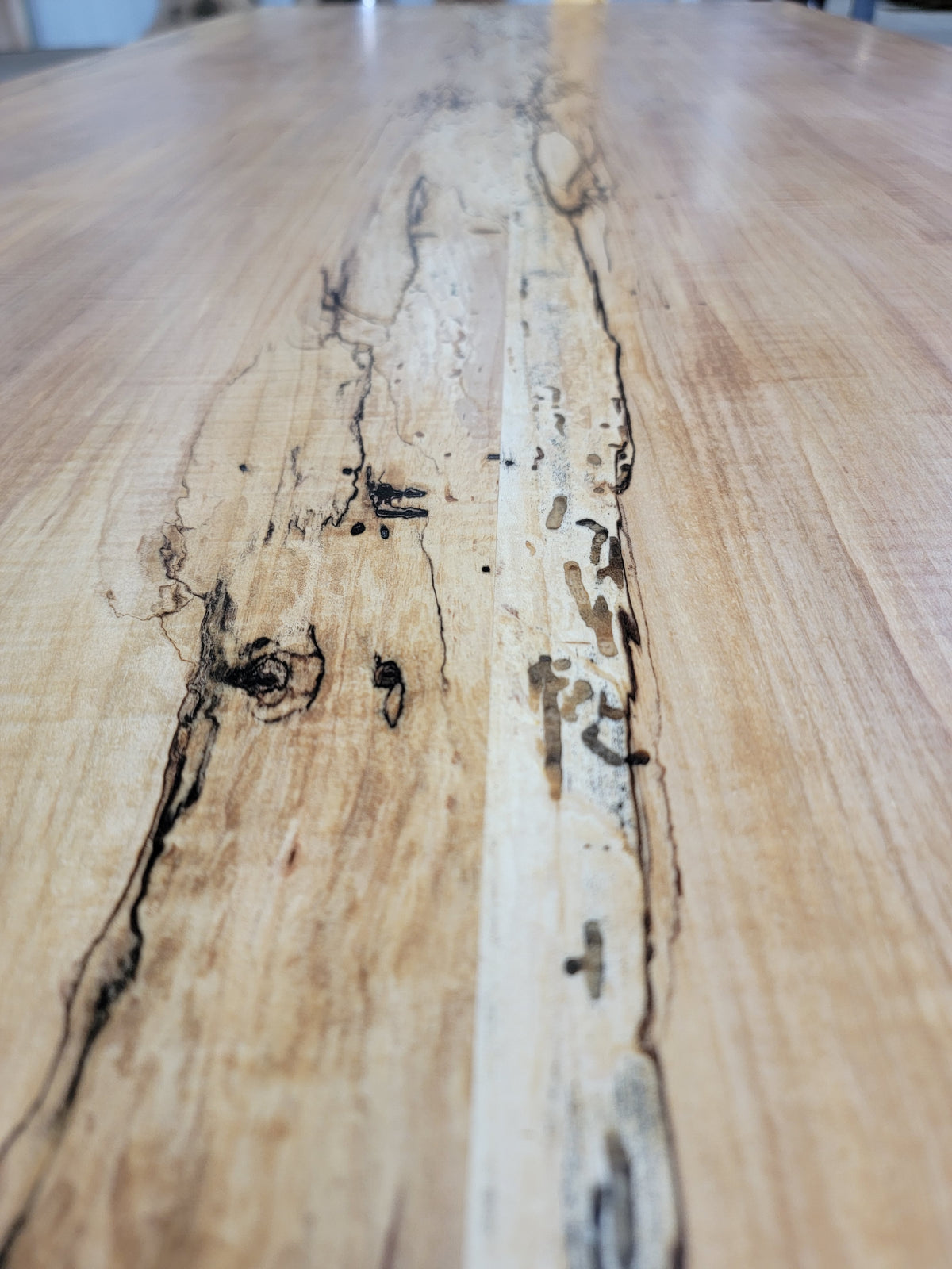 maple dining table on steel base