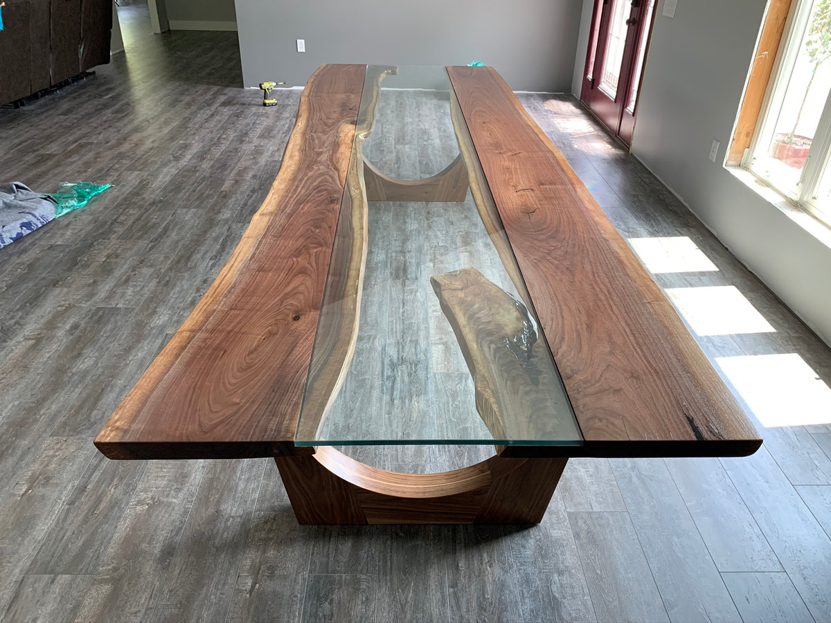 Black walnut glass river dining table on wood legs