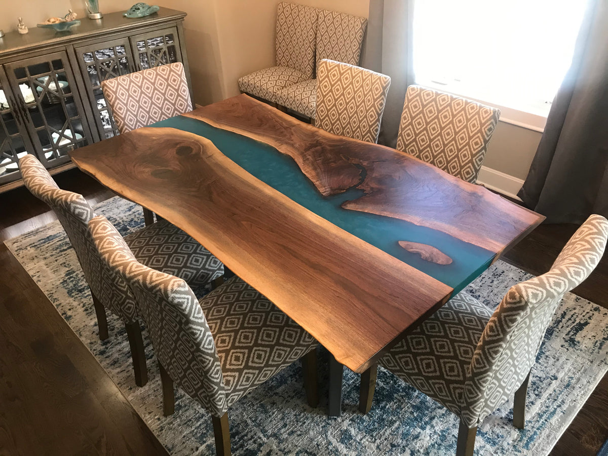 live edge black walnut epoxy river dining table with blue epoxy