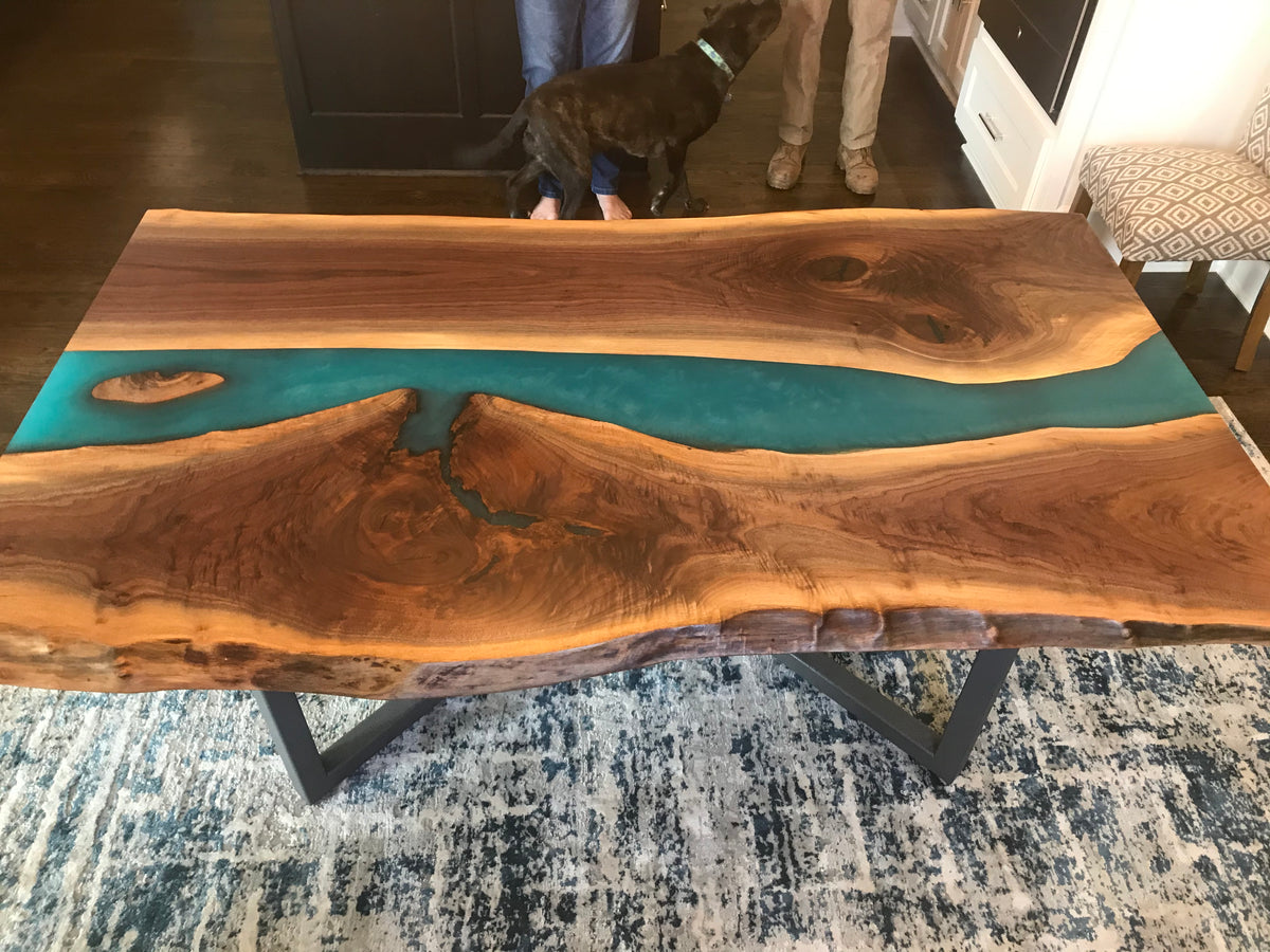 live edge black walnut epoxy river dining table with blue epoxy
