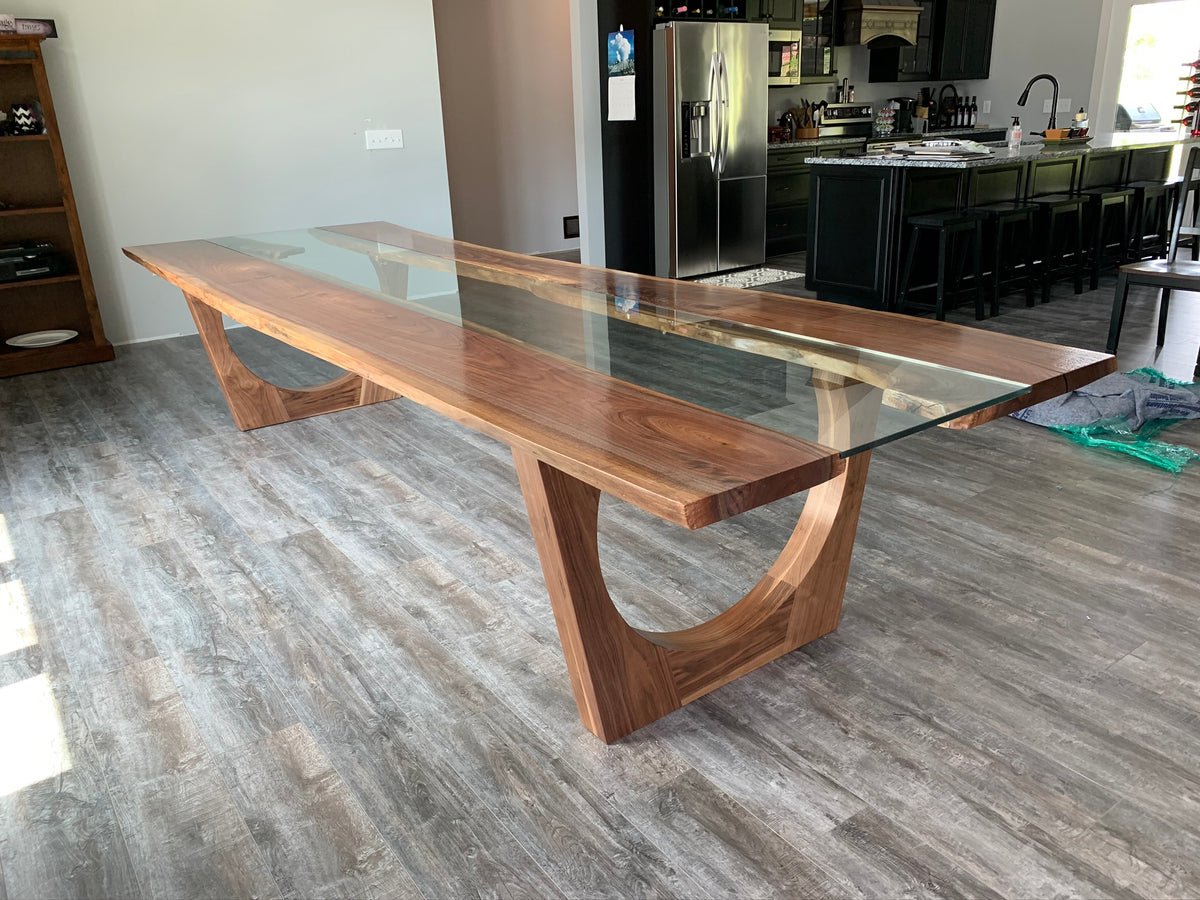 Black walnut glass river dining table on wood legs