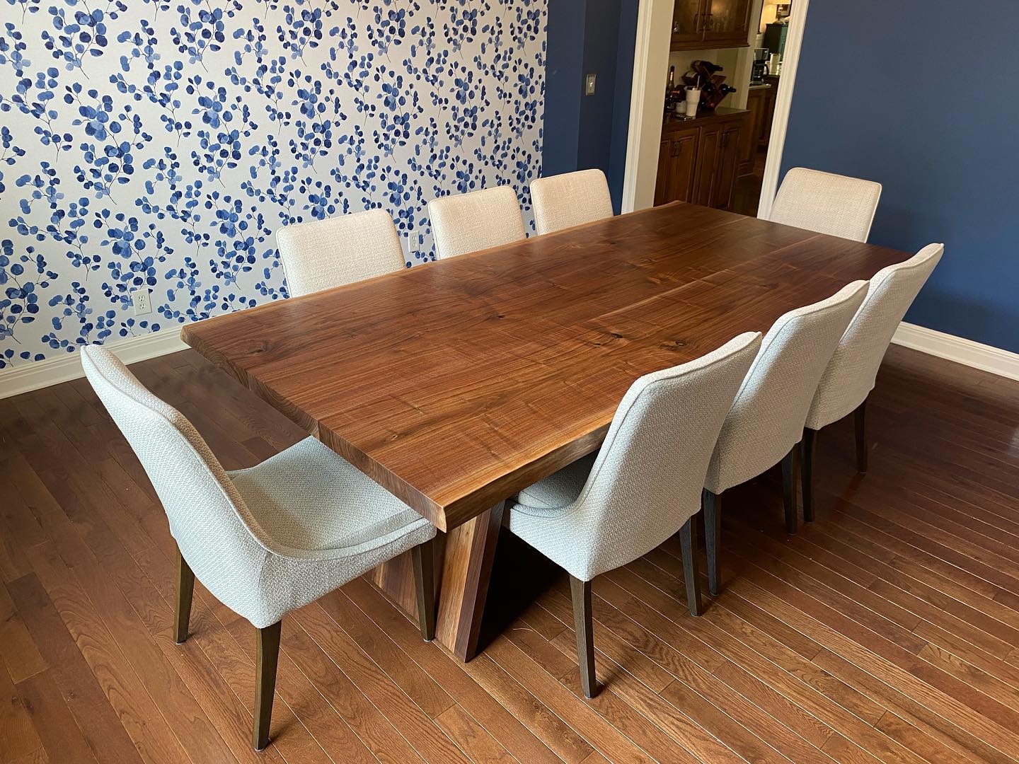 Live edge black walnut dining table with wood legs